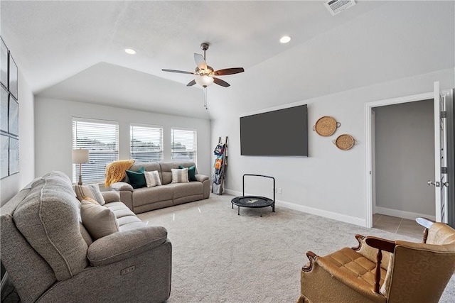 carpeted living room featuring vaulted ceiling and ceiling fan