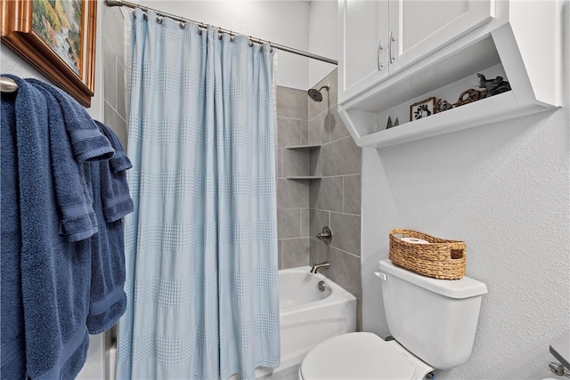 bathroom featuring shower / bath combo and toilet