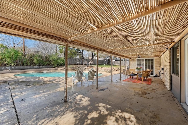 view of pool with a pergola and a patio area