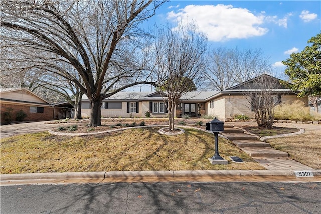 ranch-style home with a front yard