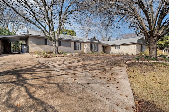 ranch-style house with a carport