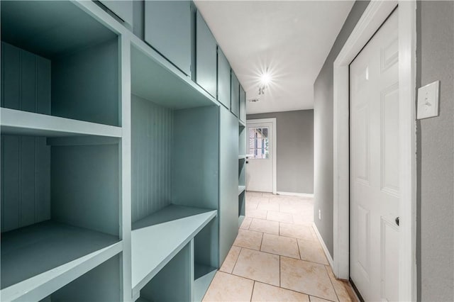 mudroom with light tile patterned floors