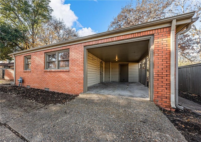 view of side of property featuring a carport