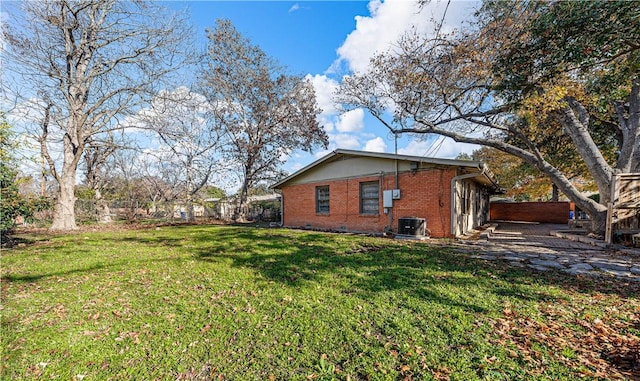 view of property exterior featuring cooling unit and a lawn