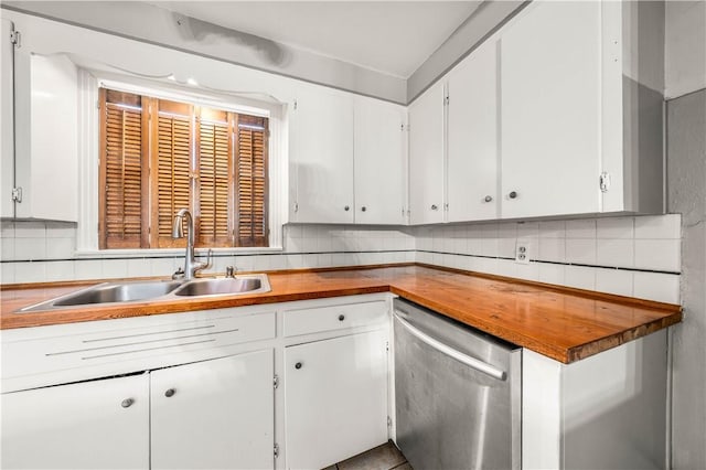 kitchen with dishwasher, white cabinetry, sink, and tasteful backsplash