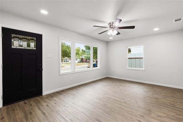 entrance foyer with hardwood / wood-style floors and ceiling fan