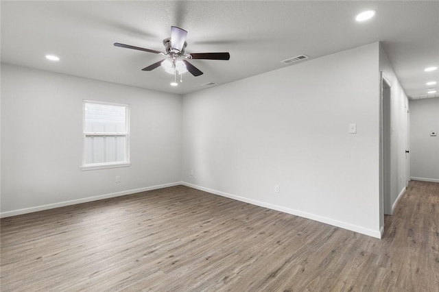 spare room with ceiling fan and light hardwood / wood-style flooring