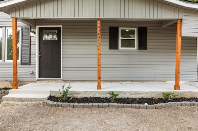 doorway to property featuring a porch