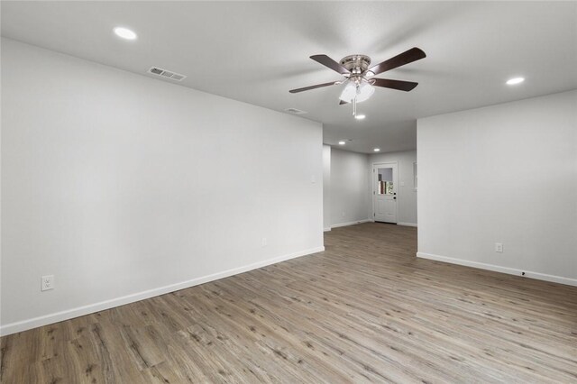 unfurnished room featuring light hardwood / wood-style floors and ceiling fan