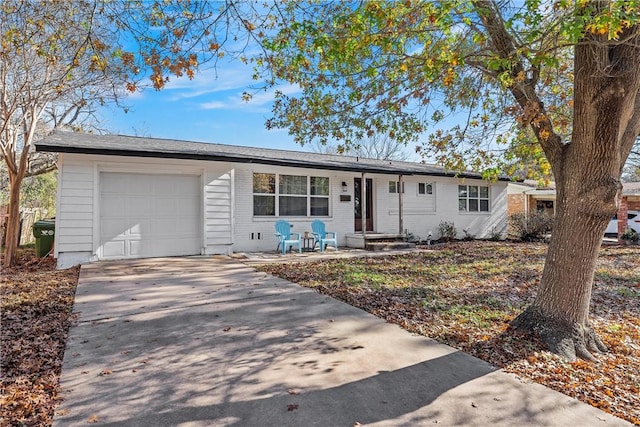 ranch-style house featuring a garage