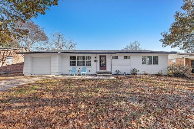 ranch-style home with a garage