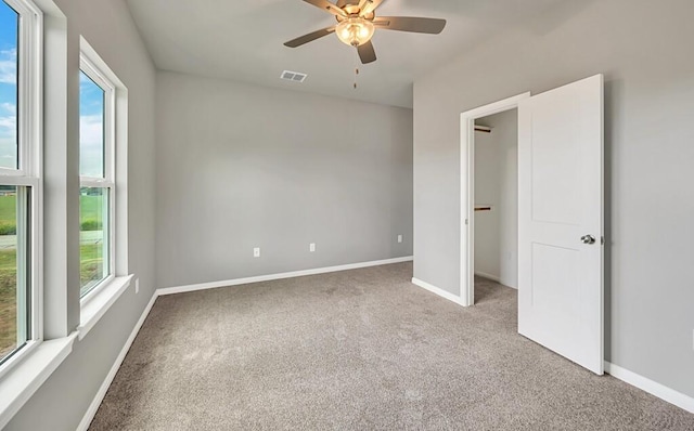 unfurnished bedroom with carpet and ceiling fan