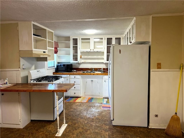 kitchen with white cabinetry, sink, butcher block countertops, white appliances, and exhaust hood