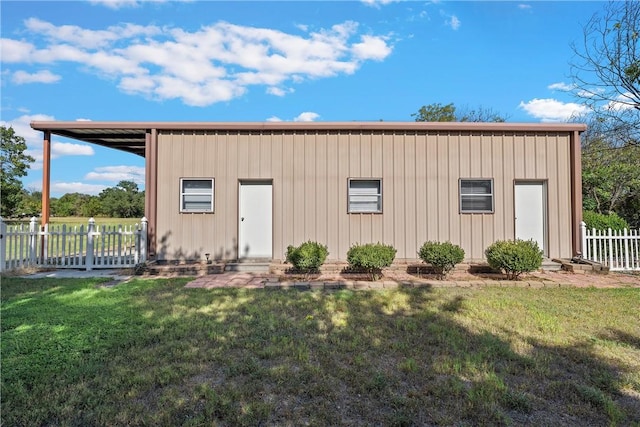 view of outbuilding with a yard