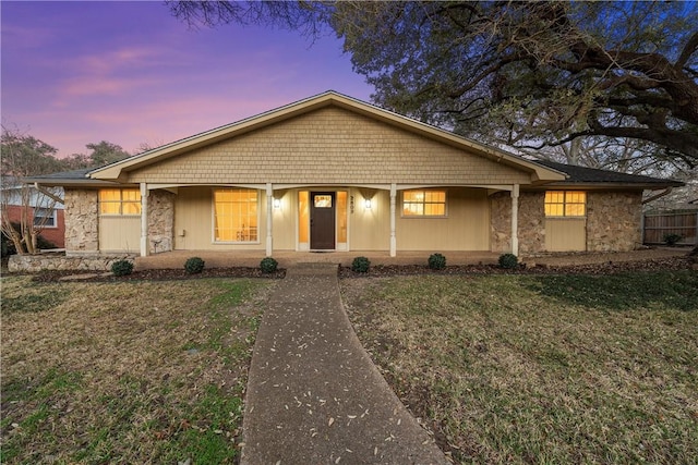 ranch-style house featuring a lawn