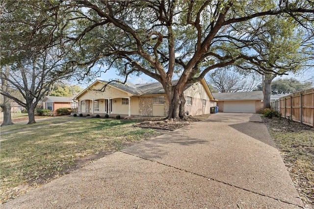 view of front of property with a garage, a porch, and a front lawn