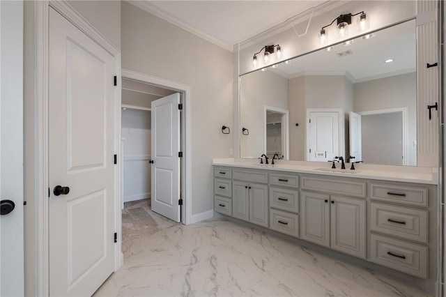 bathroom featuring crown molding and vanity