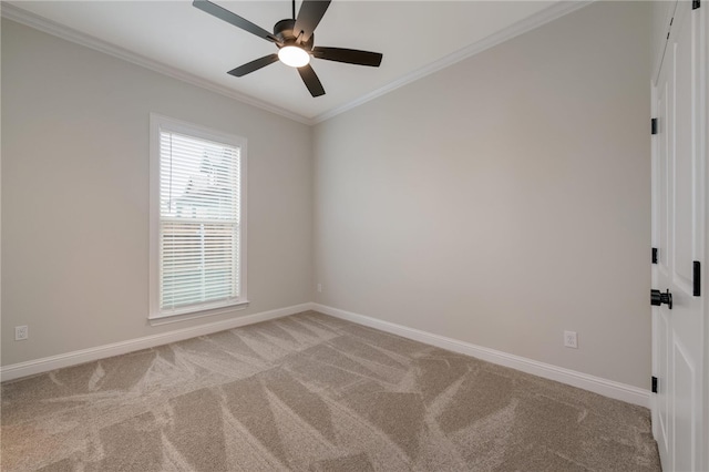 carpeted empty room featuring ceiling fan and ornamental molding