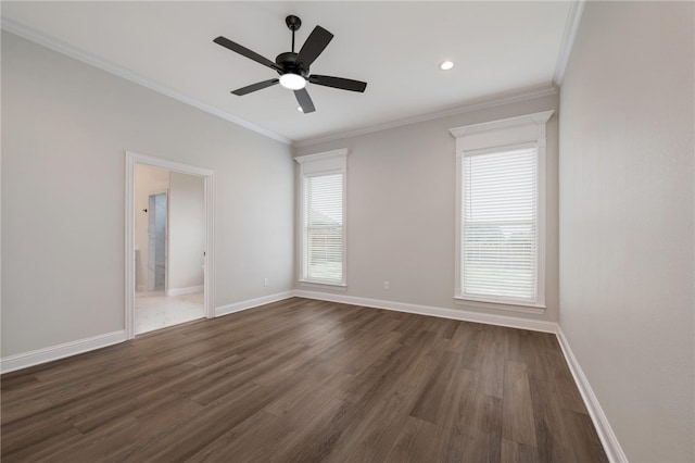 spare room with dark hardwood / wood-style flooring, ceiling fan, and ornamental molding