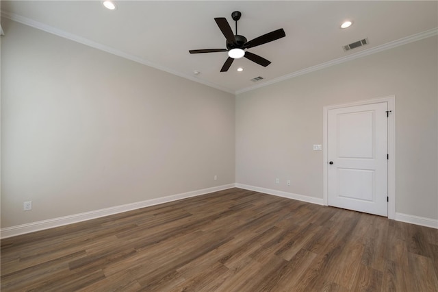 spare room with ceiling fan, dark hardwood / wood-style flooring, and crown molding