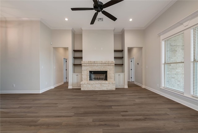 unfurnished living room featuring dark hardwood / wood-style flooring, a healthy amount of sunlight, and ornamental molding