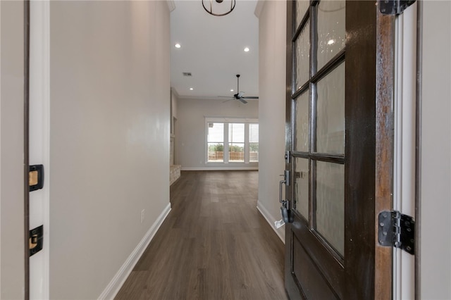 hallway with dark hardwood / wood-style flooring