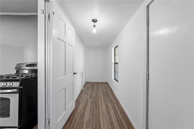 hallway featuring hardwood / wood-style floors