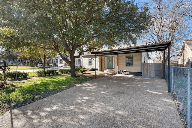 single story home with a carport and a front yard