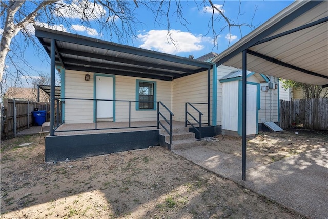 exterior space featuring a shed and a porch