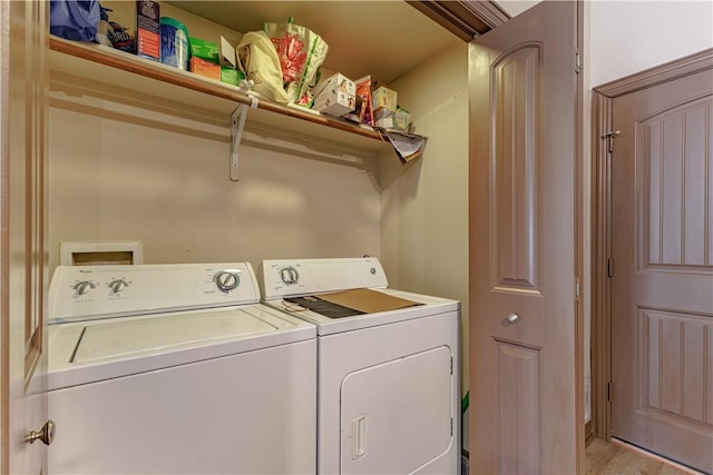 laundry room featuring independent washer and dryer and laundry area