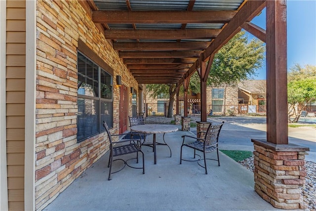 view of patio / terrace with a pergola and fence