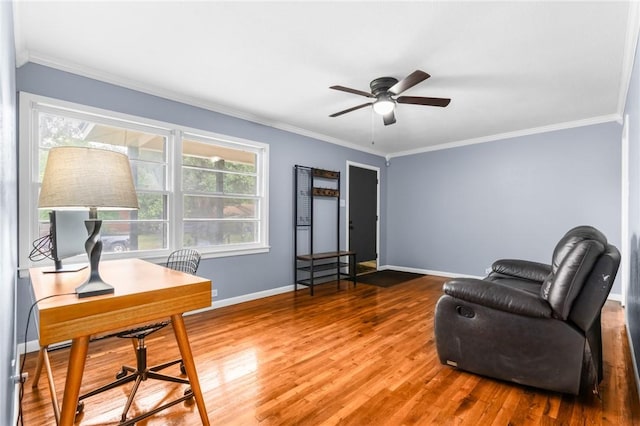 sitting room featuring ornamental molding, ceiling fan, baseboards, and wood finished floors