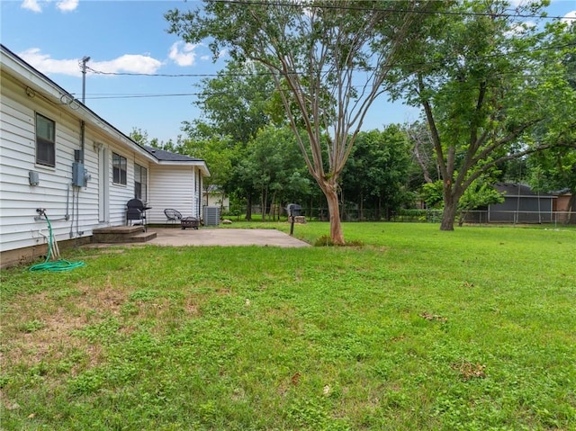 view of yard featuring fence and a patio area