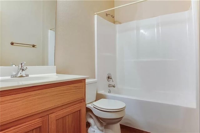 full bathroom featuring toilet, tub / shower combination, and vanity