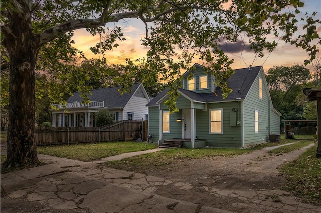 back house at dusk with central AC unit