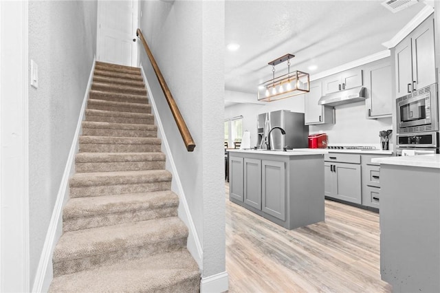 stairs featuring wood-type flooring