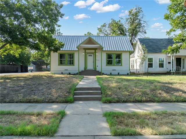 single story home with a front lawn