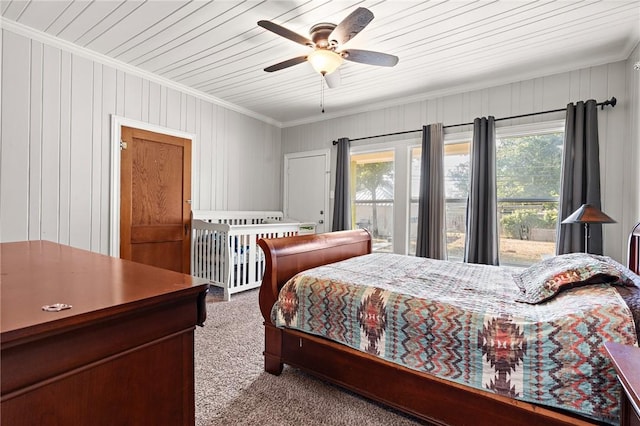 bedroom featuring carpet floors, wooden ceiling, ceiling fan, and crown molding