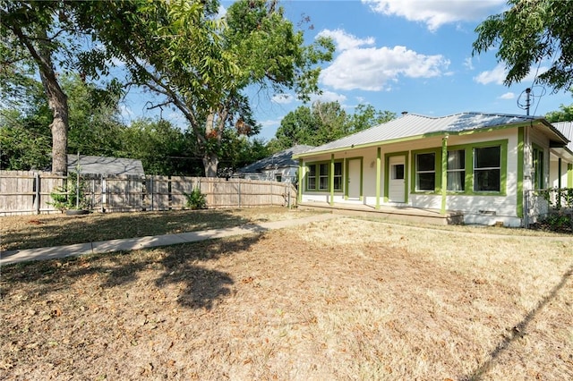 view of yard featuring covered porch