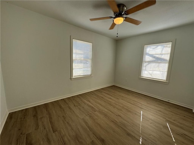 empty room featuring hardwood / wood-style floors and ceiling fan