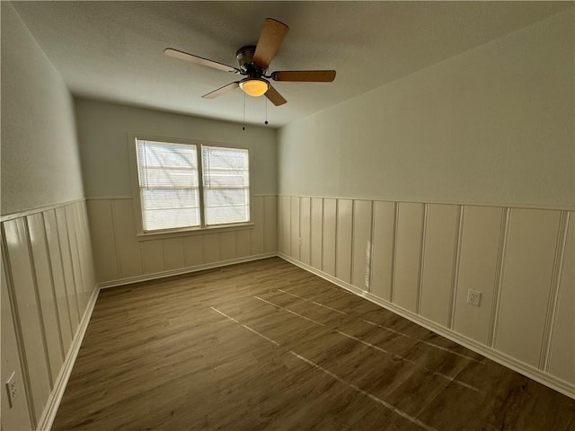 unfurnished room featuring hardwood / wood-style flooring and ceiling fan