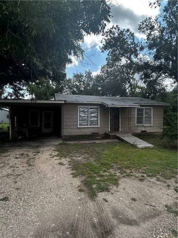 view of front of property with a carport