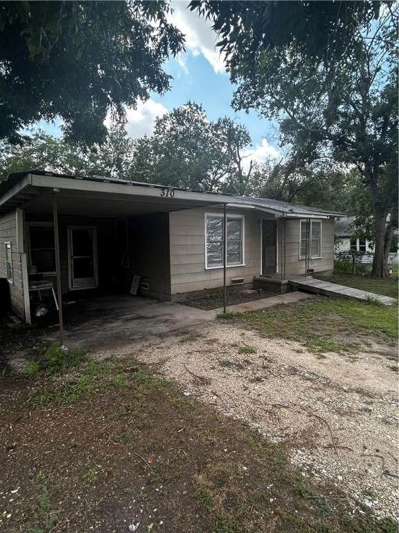 view of front of house with a carport