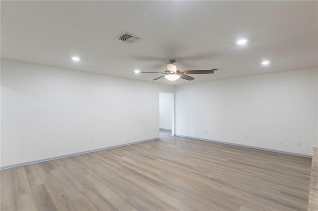 unfurnished room with light hardwood / wood-style floors