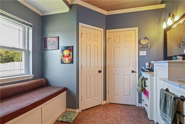 bathroom with tile patterned flooring and ornamental molding