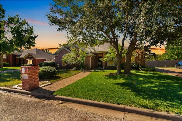 view of front of property with a yard