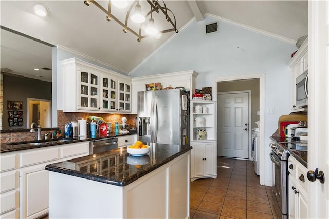 kitchen featuring a center island, sink, white cabinets, and appliances with stainless steel finishes