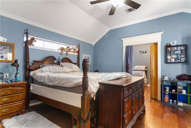 bedroom with ornamental molding, dark wood-type flooring, ceiling fan, and lofted ceiling