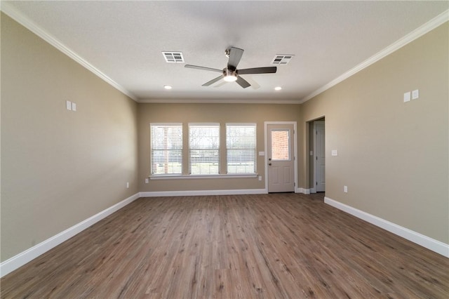 interior space with ceiling fan, wood-type flooring, and crown molding