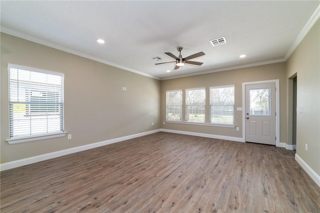 interior space featuring hardwood / wood-style flooring, ceiling fan, and ornamental molding